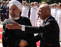 Iran’s President Hassan Rouhani shakes hands with Afghan President Mohammad Ashraf Ghani (right) during an official welcoming ceremony at the Saadabad Palace in Tehran on 19 April 2015. Photograph: Atta Kenare/AFP/Getty Images